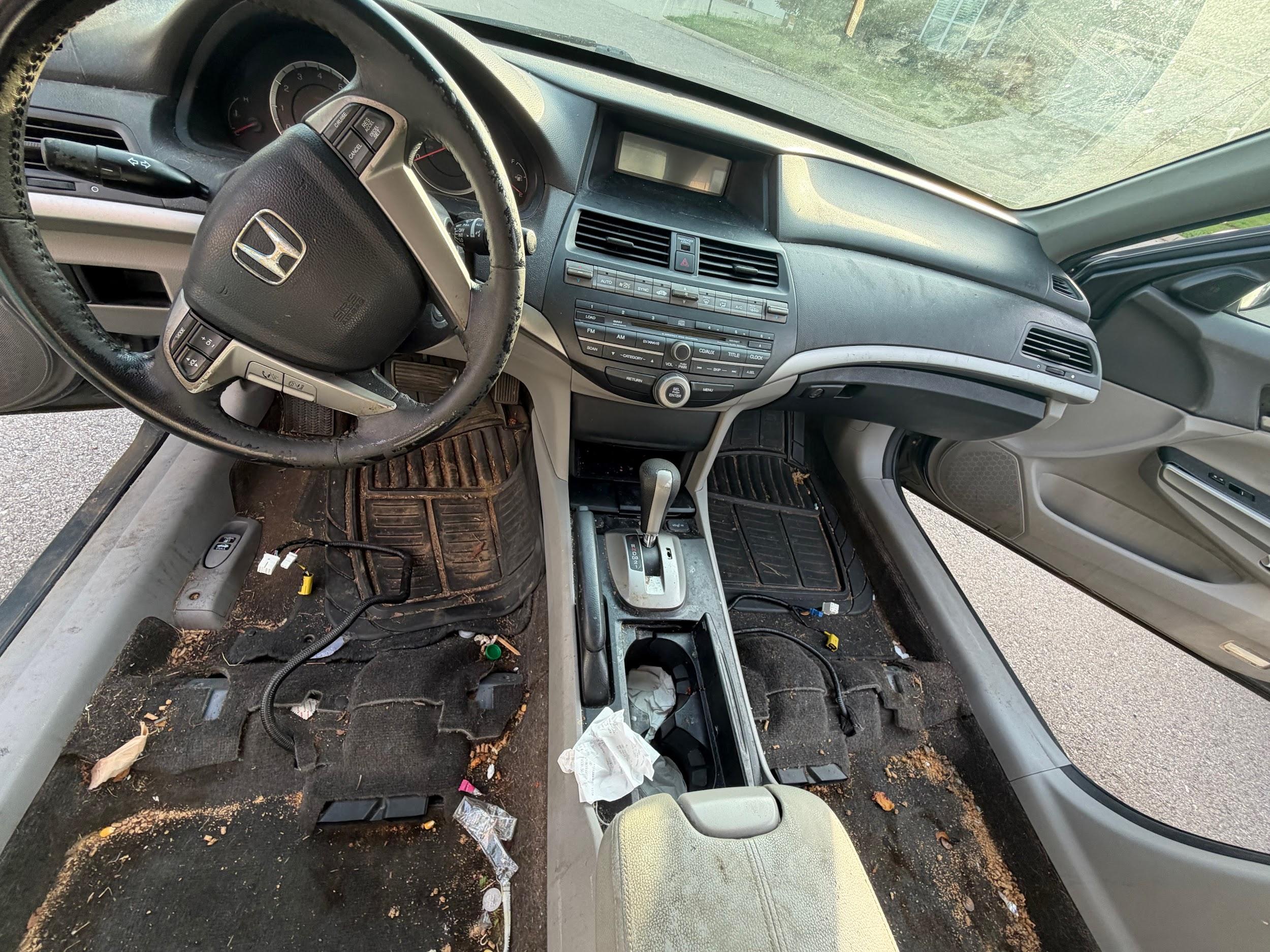 Honda Accord carpet and mats caked with dirt before shampoo