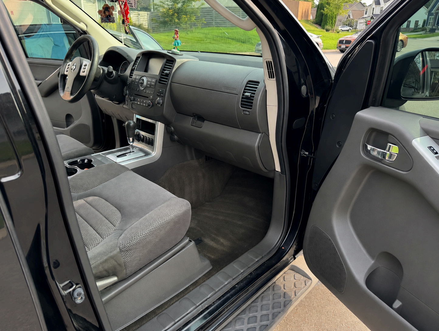 Nissan Pathfinder front seats and console after full interior detail