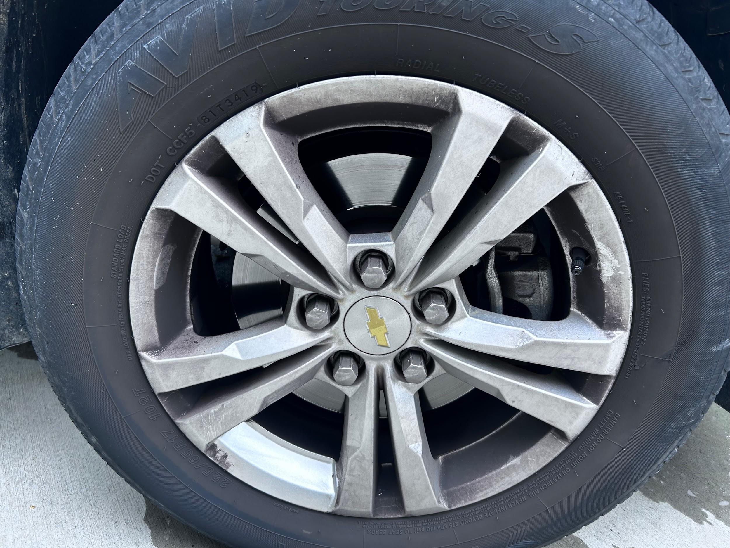 Chevrolet Equinox wheel coated in brake dust before cleaning