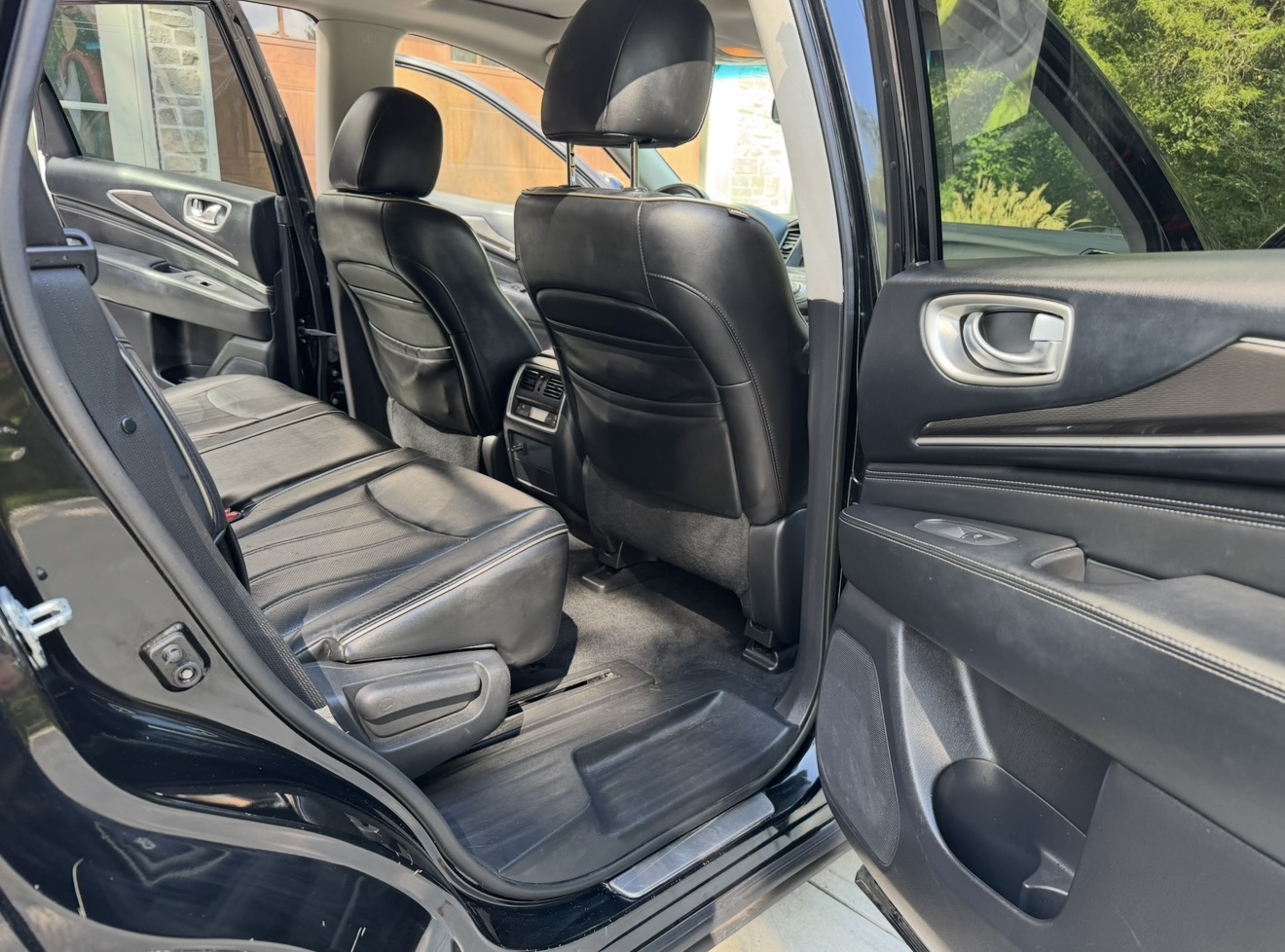 Infiniti QX60 second-row leather seats conditioned after detailing