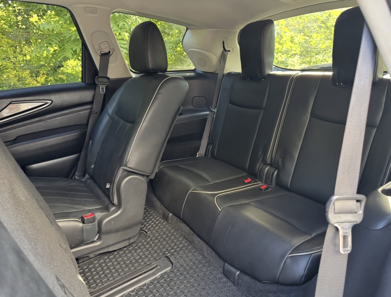 Infiniti QX60 second-row bench and carpet cleaned after detailing