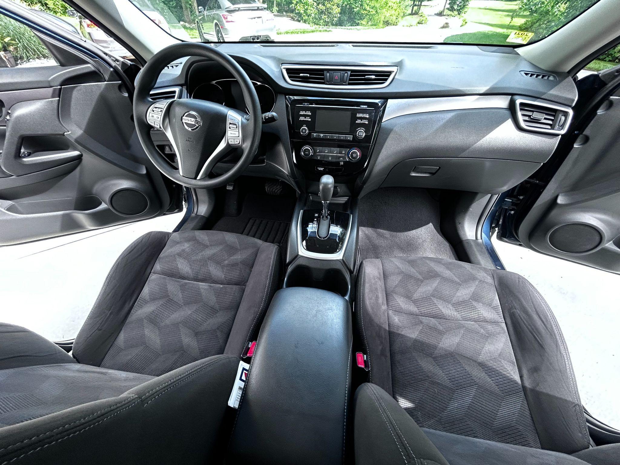 Wide view of a detailed Nissan Rogue cockpit